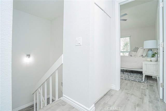 15300 Ocaso Ave Unit E102, La Mirada, CA 90638 - corridor with wood finished floors and baseboards