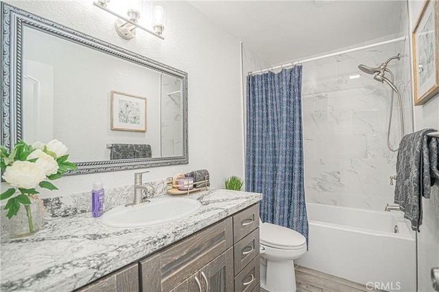 15300 Ocaso Ave Unit E102, La Mirada, CA 90638 - bathroom featuring vanity, shower / bath combination with curtain, and wood finished floors