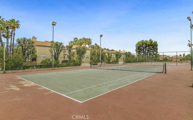 15300 Ocaso Ave Unit E102, La Mirada, CA 90638 - view of tennis court featuring community basketball court
