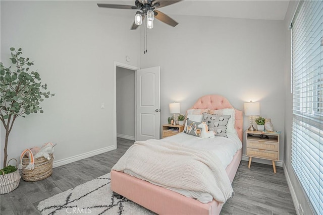 15300 Ocaso Ave Unit E102, La Mirada, CA 90638 - bedroom featuring wood finished floors, a high ceiling, and a ceiling fan