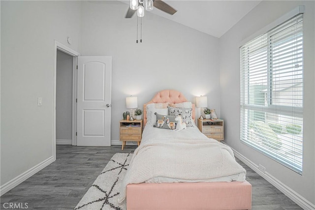 15300 Ocaso Ave Unit E102, La Mirada, CA 90638 - bedroom featuring vaulted ceiling, multiple windows, wood finished floors, and a ceiling fan