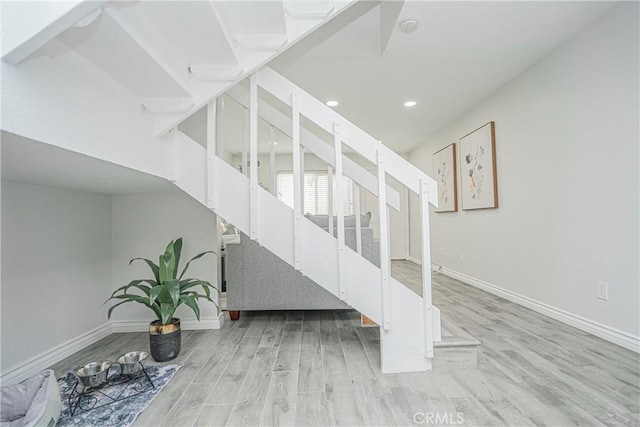 15300 Ocaso Ave Unit E102, La Mirada, CA 90638 - staircase featuring wood finished floors and recessed lighting