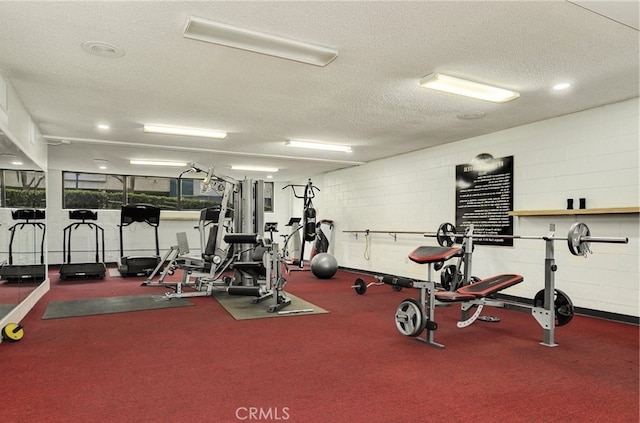 15300 Ocaso Ave Unit E102, La Mirada, CA 90638 - gym featuring a textured ceiling