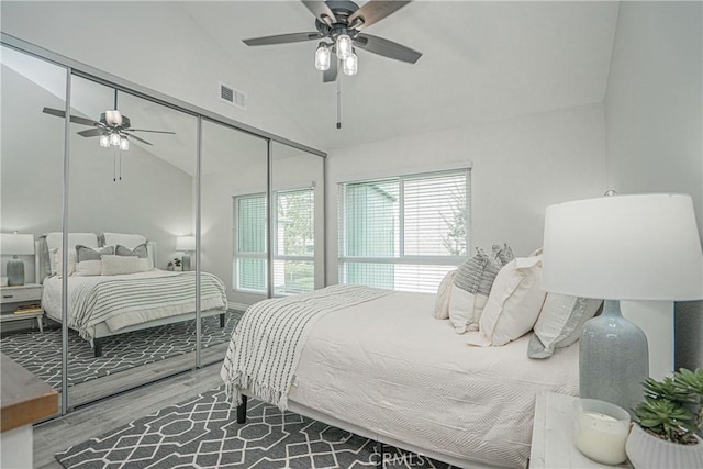 15300 Ocaso Ave Unit E102, La Mirada, CA 90638 - bedroom featuring wood finished floors, vaulted ceiling, a closet, and a ceiling fan