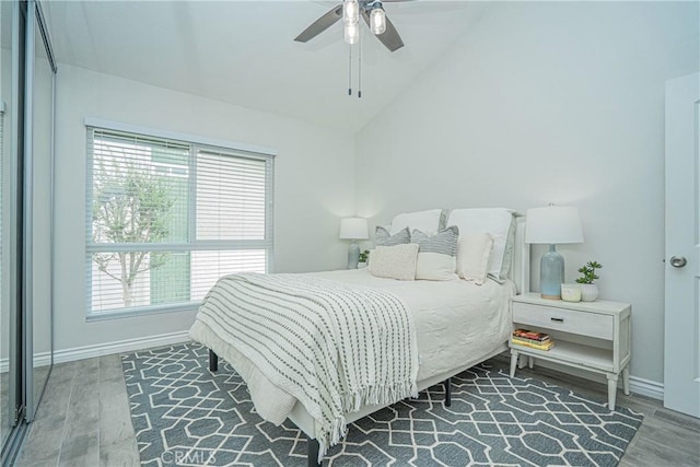 15300 Ocaso Ave Unit E102, La Mirada, CA 90638 - bedroom featuring wood finished floors, vaulted ceiling, and ceiling fan