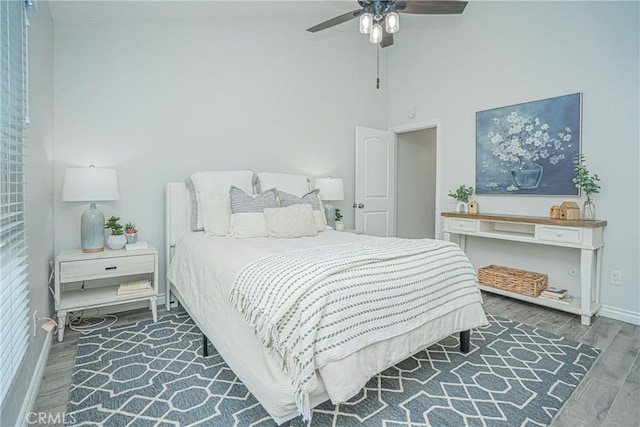 15300 Ocaso Ave Unit E102, La Mirada, CA 90638 - bedroom with wood finished floors, ceiling fan, and a towering ceiling