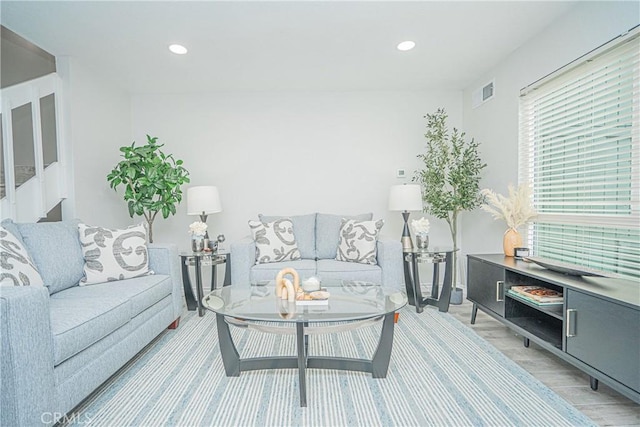15300 Ocaso Ave Unit E102, La Mirada, CA 90638 - living area with light wood-style floors and recessed lighting