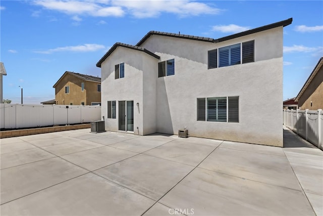27240 Lost Palm St, Menifee, CA 92585 - back of house featuring a fenced backyard, a patio area, and stucco siding