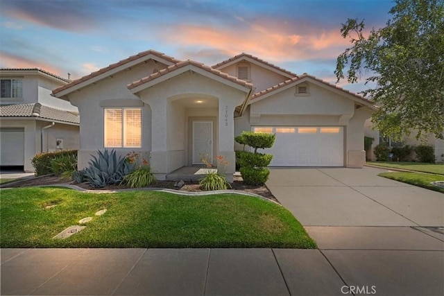 31042 Bunker Dr, Temecula, CA 92591 - mediterranean / spanish-style house with stucco siding, a front lawn, concrete driveway, and an attached garage