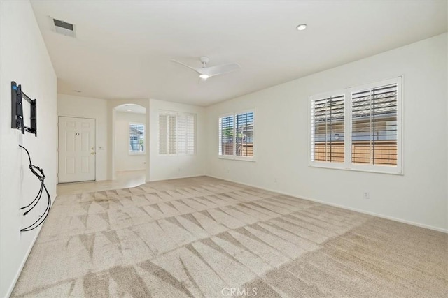 31042 Bunker Dr, Temecula, CA 92591 - empty room featuring light carpet, a ceiling fan, and arched walkways