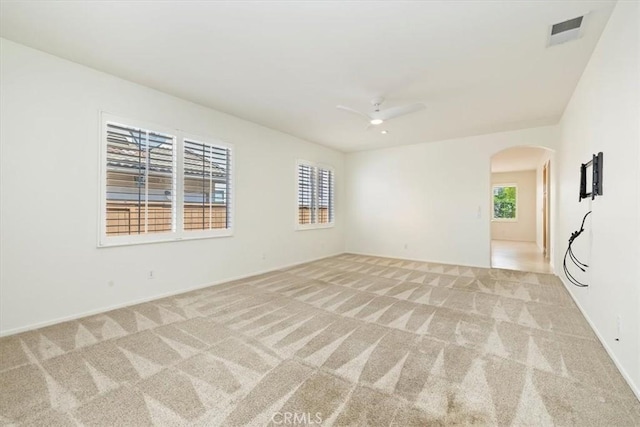 31042 Bunker Dr, Temecula, CA 92591 - unfurnished room featuring arched walkways, light carpet, and a ceiling fan
