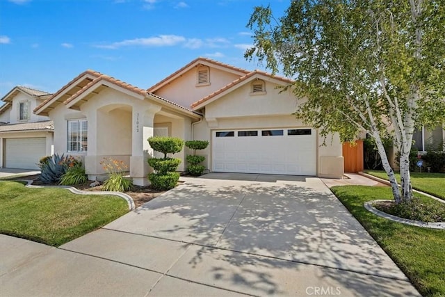 31042 Bunker Dr, Temecula, CA 92591 - view of front of property with a garage, concrete driveway, a front yard, and stucco siding