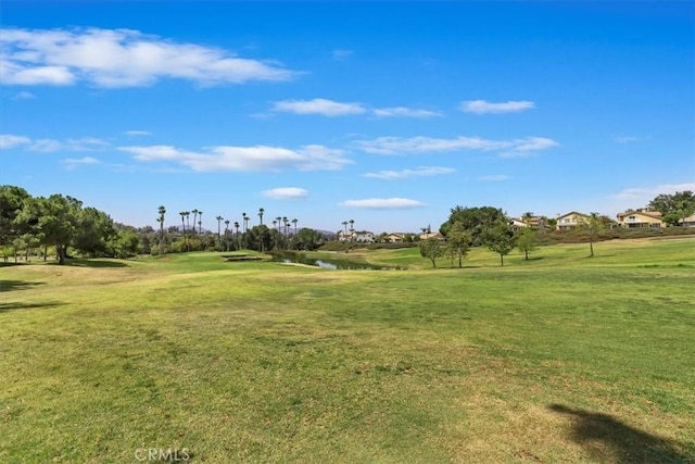 31042 Bunker Dr, Temecula, CA 92591 - view of community featuring a lawn, a water view, and view of golf course