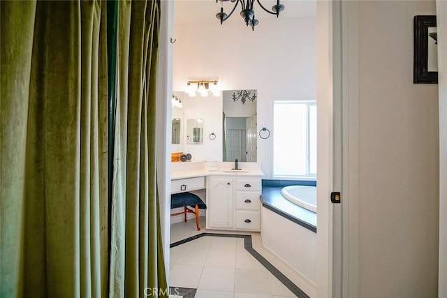 1001 Gibralter Rd, Landers, CA 92285 - full bath with vanity, a bath, tile patterned flooring, and a chandelier