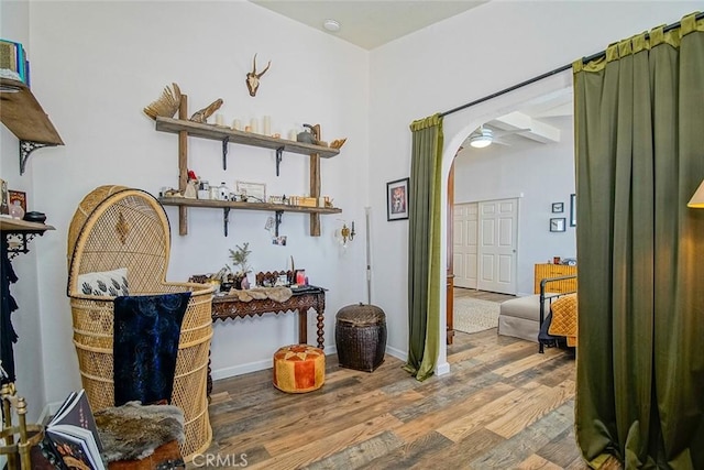 1001 Gibralter Rd, Landers, CA 92285 - bar area featuring wood finished floors, arched walkways, and a ceiling fan