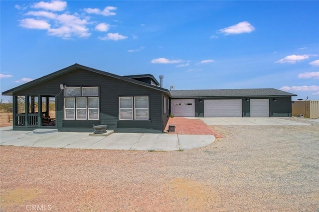 1001 Gibralter Rd, Landers, CA 92285 - view of front of home with concrete driveway and a garage