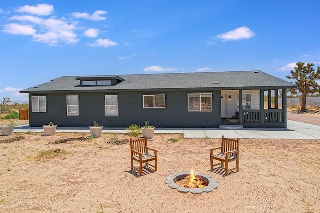 1001 Gibralter Rd, Landers, CA 92285 - back of house featuring an outdoor fire pit, roof with shingles, and a patio area