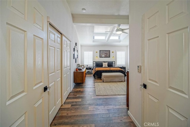 1001 Gibralter Rd, Landers, CA 92285 - hallway featuring dark wood-style flooring and baseboards