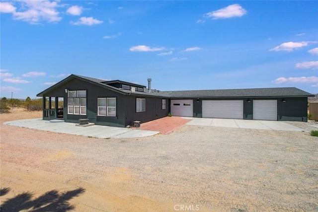 1001 Gibralter Rd, Landers, CA 92285 - view of front of house featuring driveway and a garage