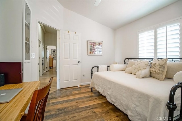 1001 Gibralter Rd, Landers, CA 92285 - bedroom with vaulted ceiling, wood finished floors, and a ceiling fan
