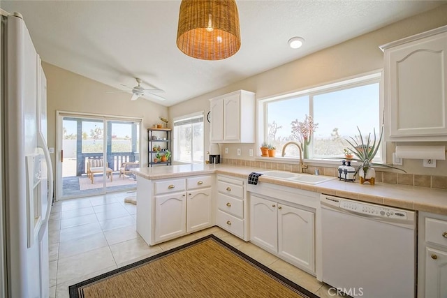 1001 Gibralter Rd, Landers, CA 92285 - kitchen with white appliances, a peninsula, white cabinetry, lofted ceiling, and ceiling fan
