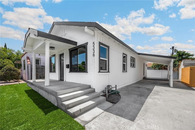 5336 Stratford Rd, Los Angeles, CA 90042 - view of front of house featuring covered porch, a carport, and concrete driveway