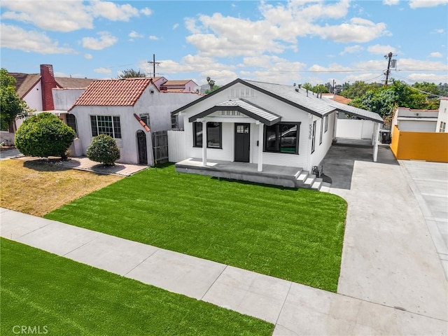5336 Stratford Rd, Los Angeles, CA 90042 - view of front of house with driveway, a carport, and covered porch