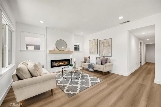 5336 Stratford Rd, Los Angeles, CA 90042 - living room featuring wood finished floors, a fireplace, and recessed lighting