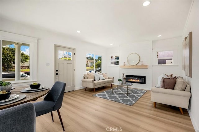 5336 Stratford Rd, Los Angeles, CA 90042 - living room with light wood-style floors, a fireplace, and recessed lighting