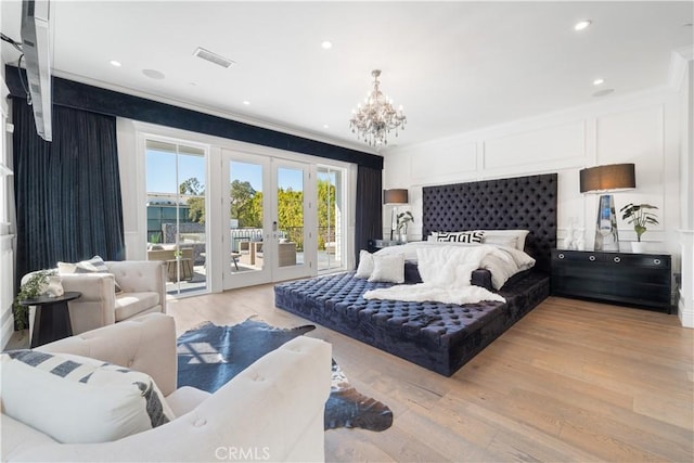 17528 Jayden Ln, Encino, CA 91316 - bedroom with access to exterior, french doors, a chandelier, ornamental molding, and light wood-style floors