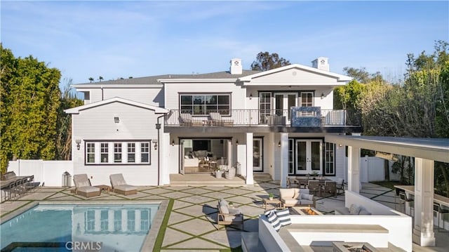 17528 Jayden Ln, Encino, CA 91316 - rear view of property featuring french doors, a balcony, a patio area, and a chimney