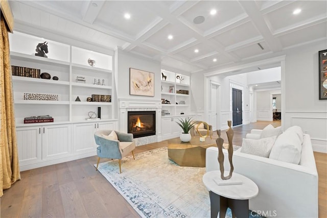 17528 Jayden Ln, Encino, CA 91316 - living area featuring light wood-style flooring, a lit fireplace, beamed ceiling, built in features, and recessed lighting