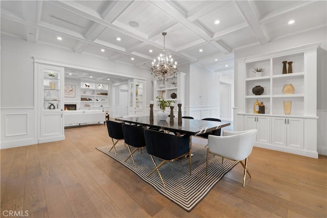 17528 Jayden Ln, Encino, CA 91316 - dining area with light wood-type flooring, a decorative wall, coffered ceiling, recessed lighting, and a chandelier