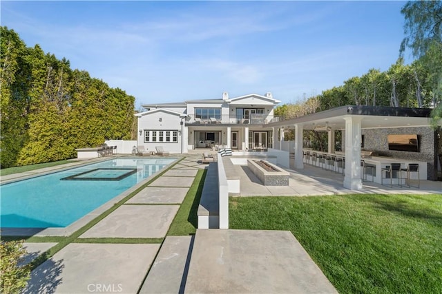 17528 Jayden Ln, Encino, CA 91316 - back of house featuring a patio, a balcony, a yard, an outdoor kitchen, and a chimney