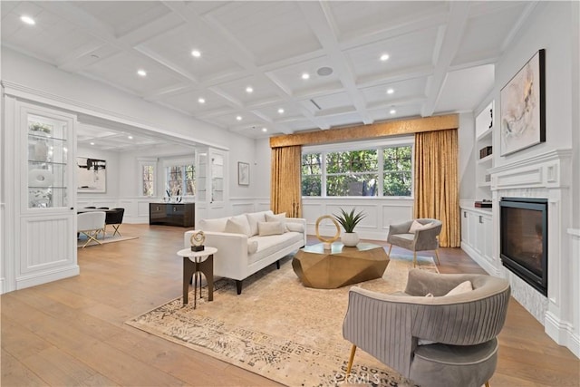 17528 Jayden Ln, Encino, CA 91316 - living area featuring a decorative wall, light wood finished floors, recessed lighting, coffered ceiling, and a glass covered fireplace