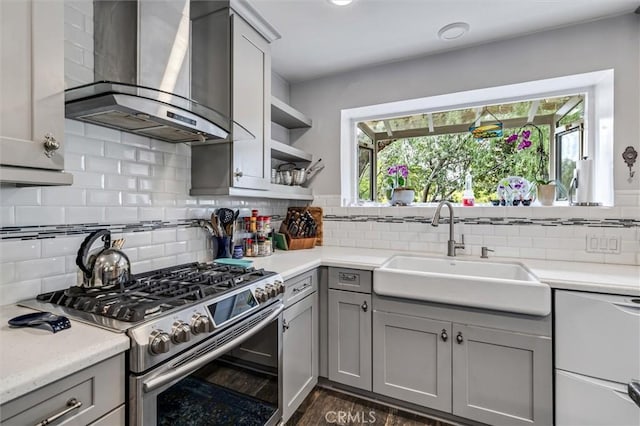 5729 Grandview Ave, Yorba Linda, CA 92886 - kitchen with wall chimney range hood, gas range, gray cabinetry, and light countertops