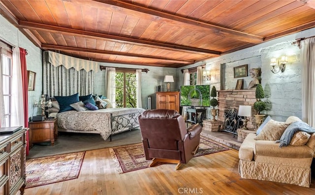 5729 Grandview Ave, Yorba Linda, CA 92886 - bedroom with a wooden ceiling with exposed beams, hardwood / wood-style flooring, and a fireplace
