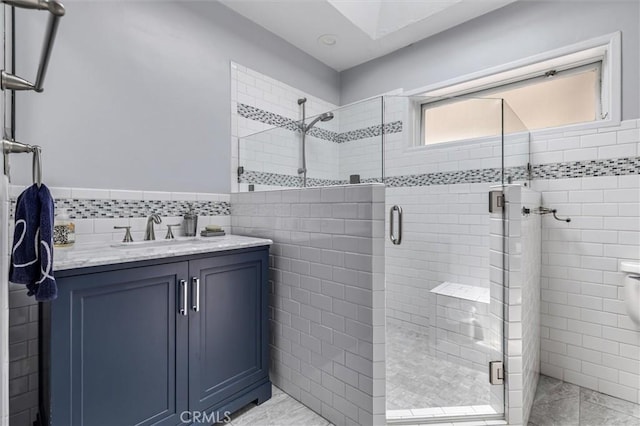 5729 Grandview Ave, Yorba Linda, CA 92886 - full bath featuring tile walls, a shower stall, marble look tile flooring, vanity, and wainscoting