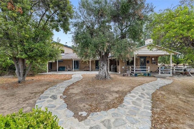 5729 Grandview Ave, Yorba Linda, CA 92886 - back of house with covered porch and a chimney