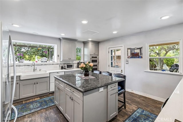 5729 Grandview Ave, Yorba Linda, CA 92886 - kitchen with gray cabinetry, appliances with stainless steel finishes, healthy amount of natural light, and recessed lighting
