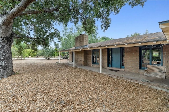 5729 Grandview Ave, Yorba Linda, CA 92886 - back of house featuring a chimney and a patio
