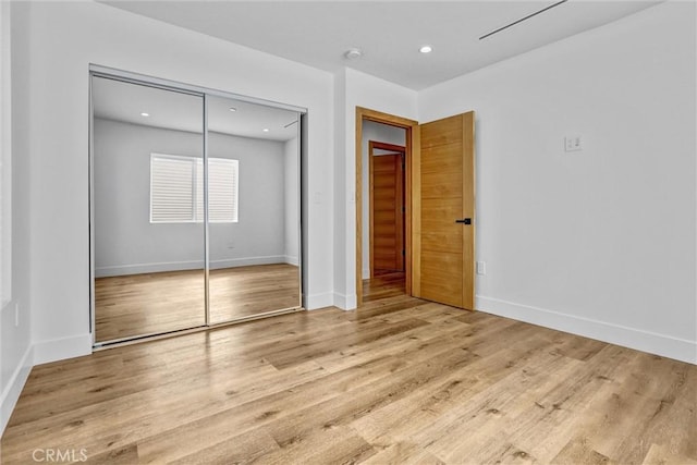 6904 Corbin Ave, Reseda, CA 91335 - unfurnished bedroom featuring a closet, wood finished floors, and recessed lighting