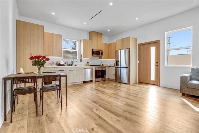 6904 Corbin Ave, Reseda, CA 91335 - kitchen with stainless steel appliances, modern cabinets, light brown cabinetry, light wood-style floors, and recessed lighting