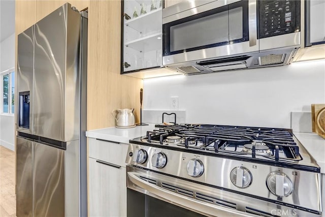 6904 Corbin Ave, Reseda, CA 91335 - kitchen with stainless steel appliances, light countertops, and modern cabinets