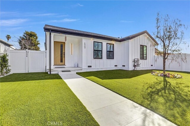 6904 Corbin Ave, Reseda, CA 91335 - modern farmhouse style home featuring board and batten siding and a gate