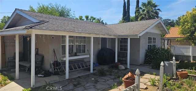 5827 Corbin Ave, Tarzana, CA 91356 - back of house with stucco siding, a patio area, and roof with shingles