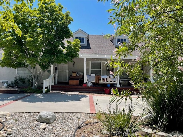 5827 Corbin Ave, Tarzana, CA 91356 - obstructed view of property featuring a porch and a shingled roof