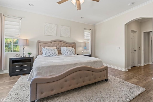 28549 Oakhurst Way, Temecula, CA 92591 - bedroom with arched walkways, wood finished floors, ornamental molding, and a ceiling fan