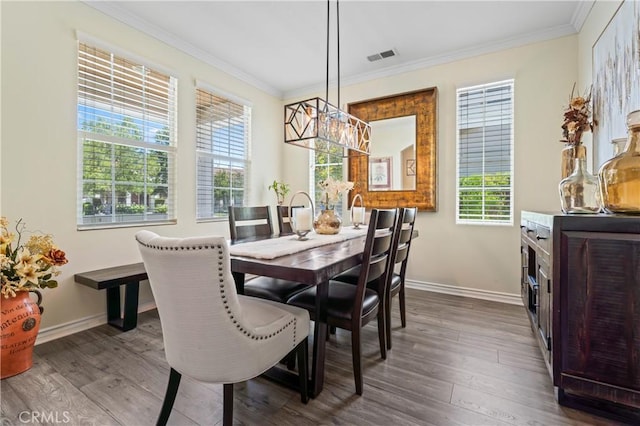 28549 Oakhurst Way, Temecula, CA 92591 - dining room featuring ornamental molding, dark wood-type flooring, and a chandelier