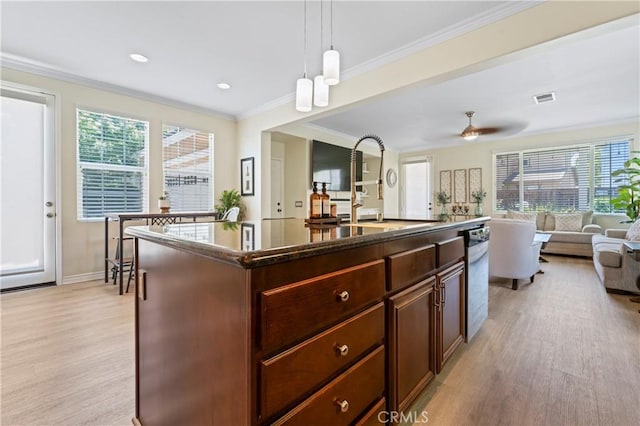 28549 Oakhurst Way, Temecula, CA 92591 - kitchen featuring open floor plan, light wood-style flooring, stainless steel dishwasher, plenty of natural light, and ornamental molding